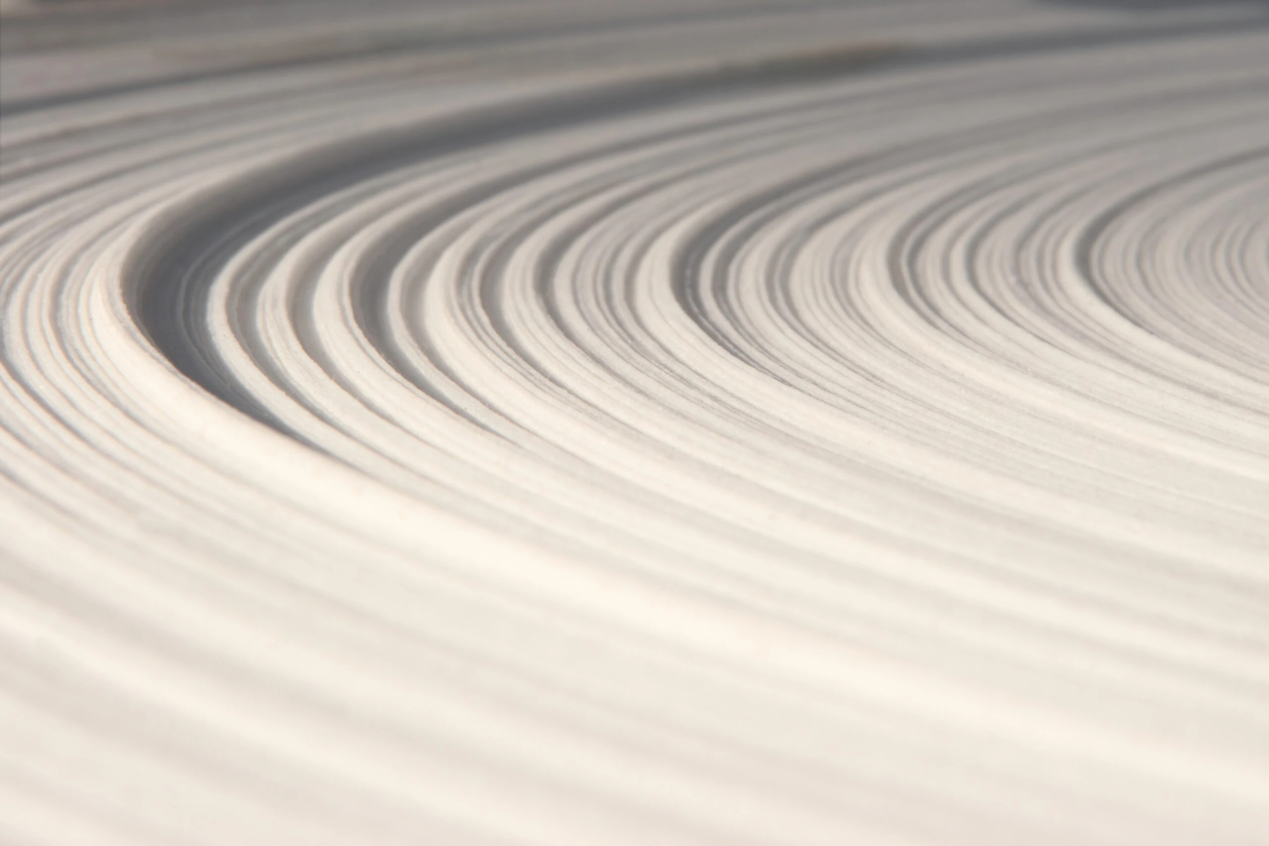 Paper roll close-up Close-up view of wet paper pulp fibers in a manufacturing process."